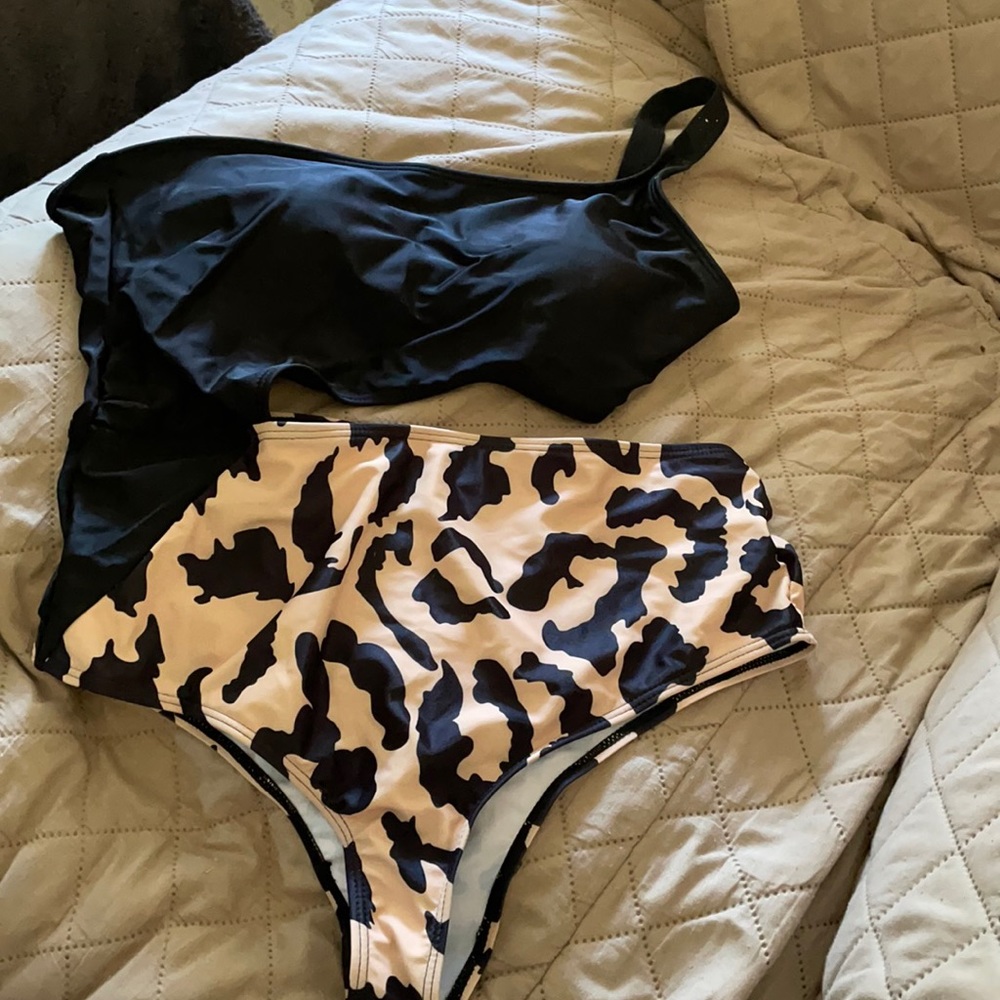One piece women’s bathing suit, never worn.